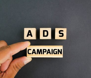 wooden block with the word ADS campaign.