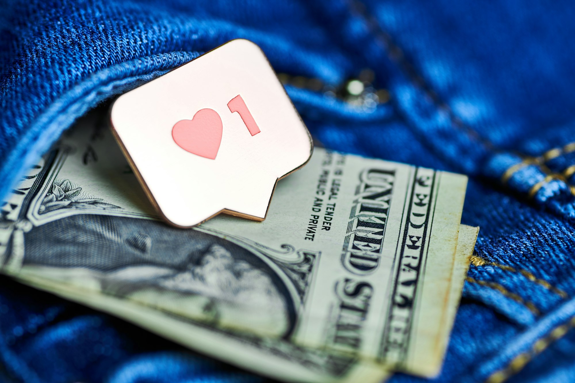 Like heart symbol and dollar in jeans pocket